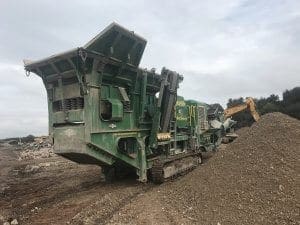 The large crusher on site clearing concrete to make way for park leaving in Selby, North Yorkshire.