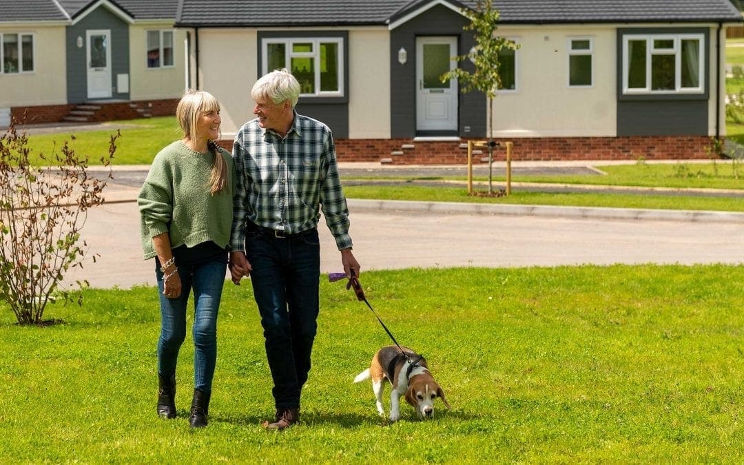 Couple walking the dog at Gateforth Park