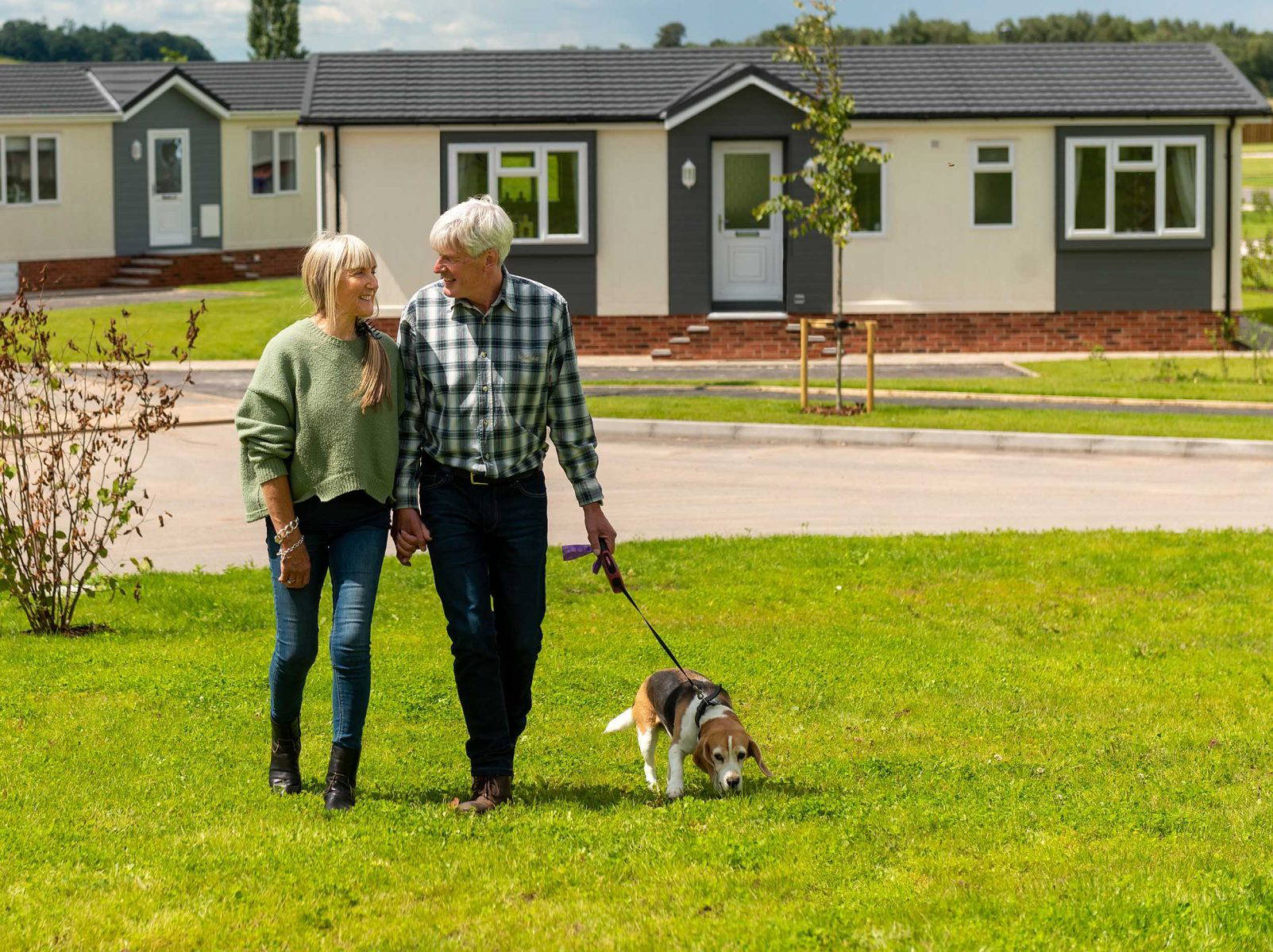 Couple walking the dog at Gateforth Park