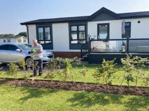 man, car and house image