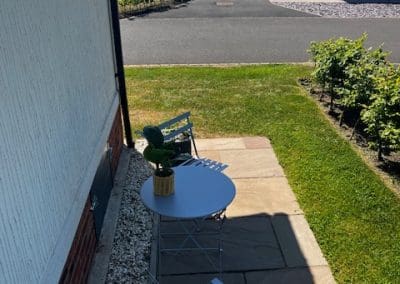 Outdoor seating area with a view of the lake at Gateforth Park residential park home