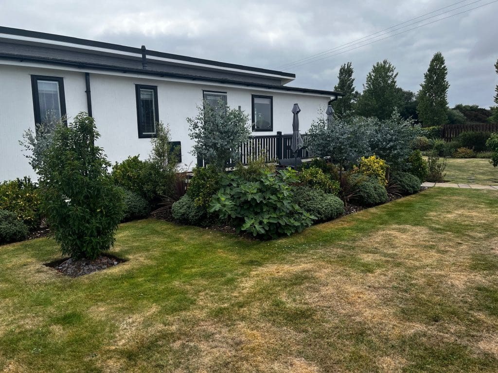 Residential park home with landscaped garden at Gateforth Park