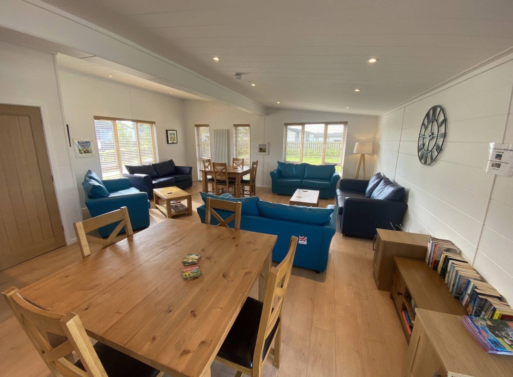 Spacious community lounge and dining area at Gateforth Park residential park homes